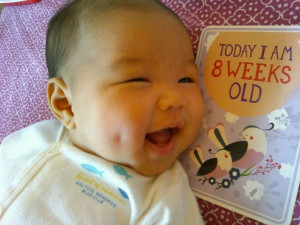 baby with milestone card